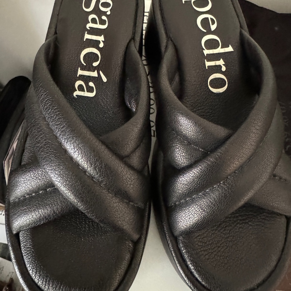 Pedro Garcia slides in black. Size 38.5. Wedge heel is 3” with 1.5” platform.